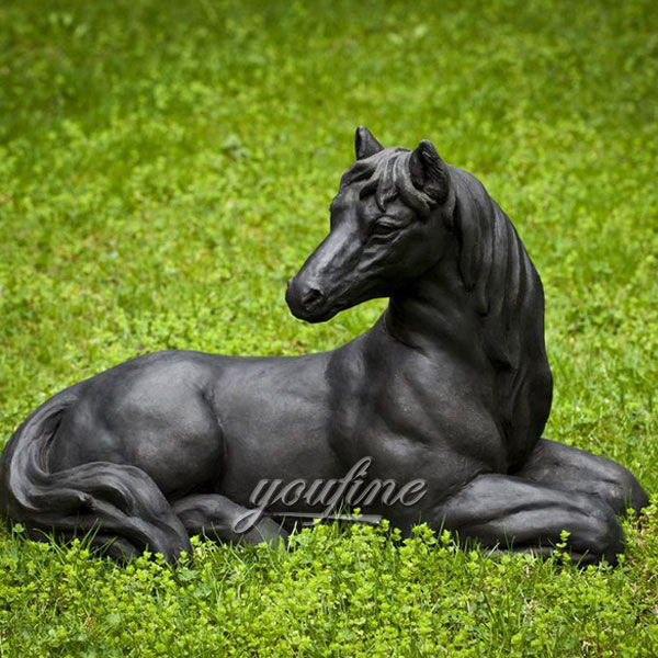 bronze statue of a cowboy riding a horse grazing horse sculpture